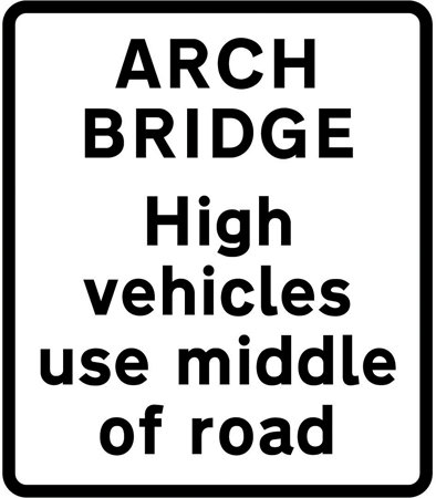 Arch bridge sign instructing high vehicles to use the middle of the road